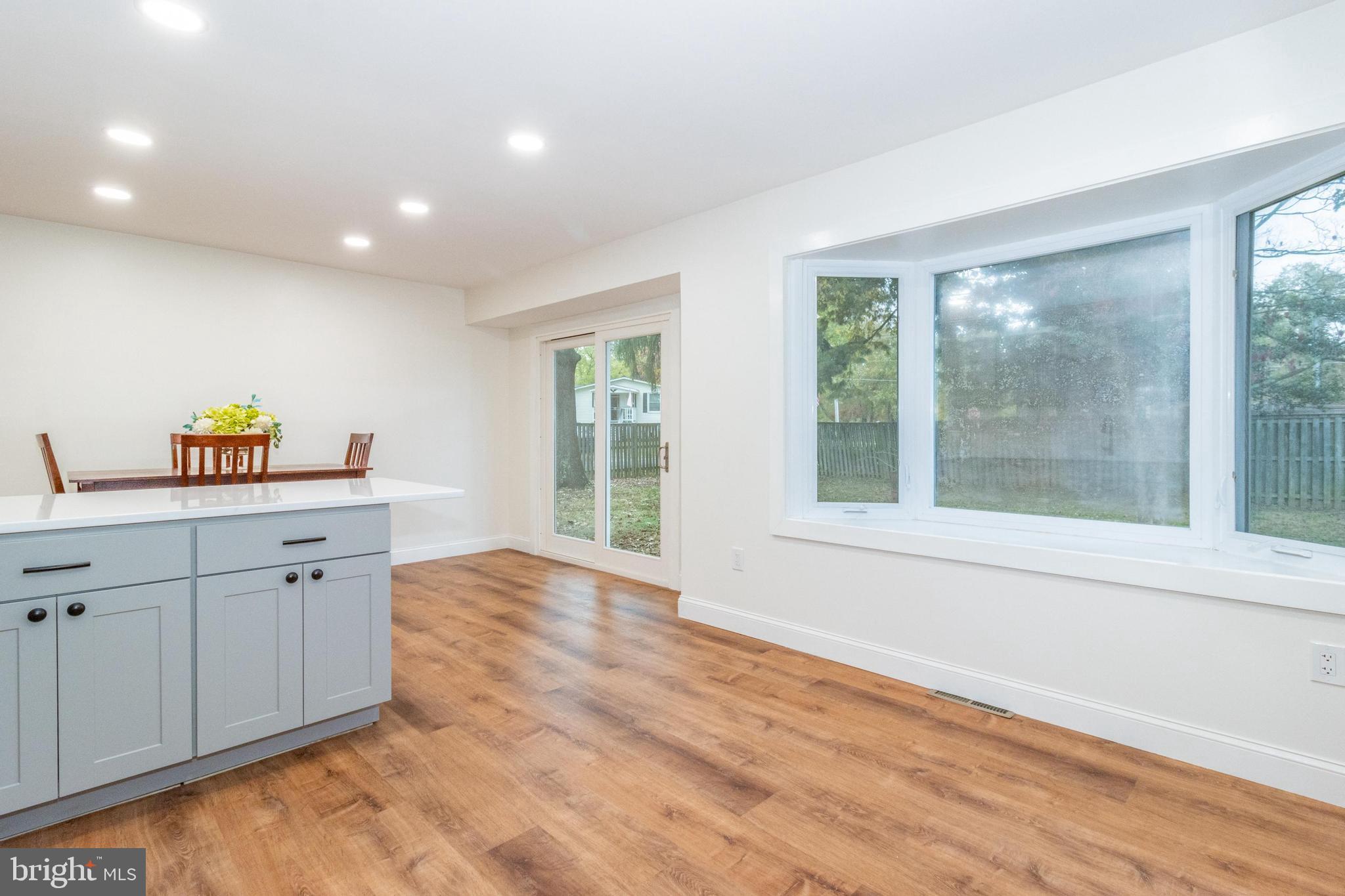 320 Kenmore Avenue Edgewater, MD 21037 - Photo 18 of 43 a hall with cabinets and a wooden floor