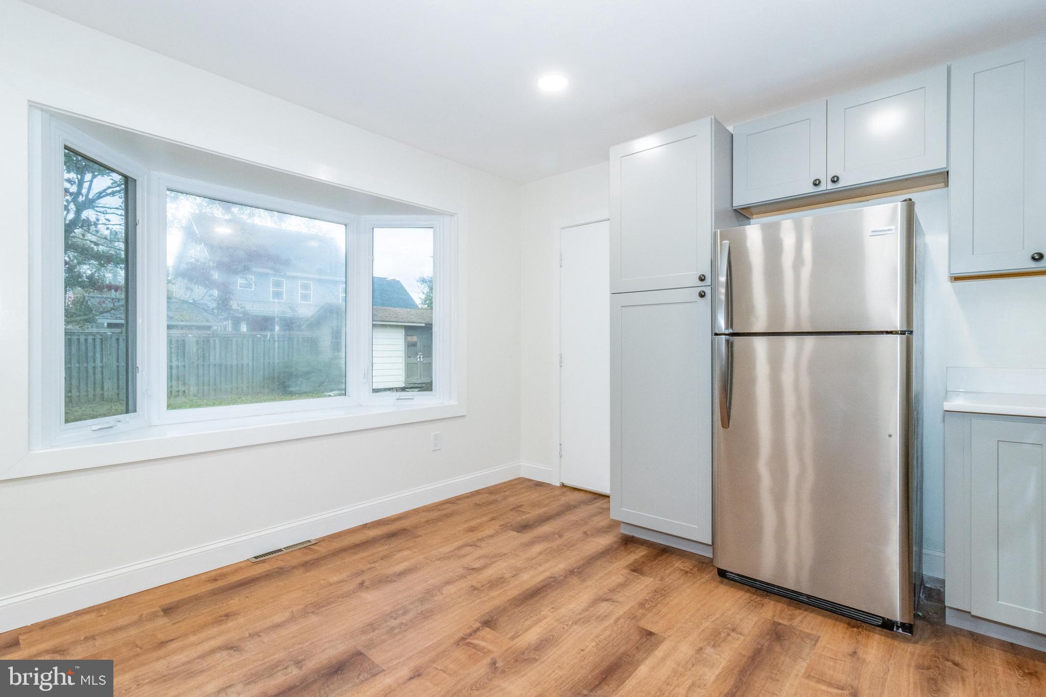 320 Kenmore Avenue Edgewater, MD 21037 - Photo 19 of 43 a view of empty room with wooden floor and window