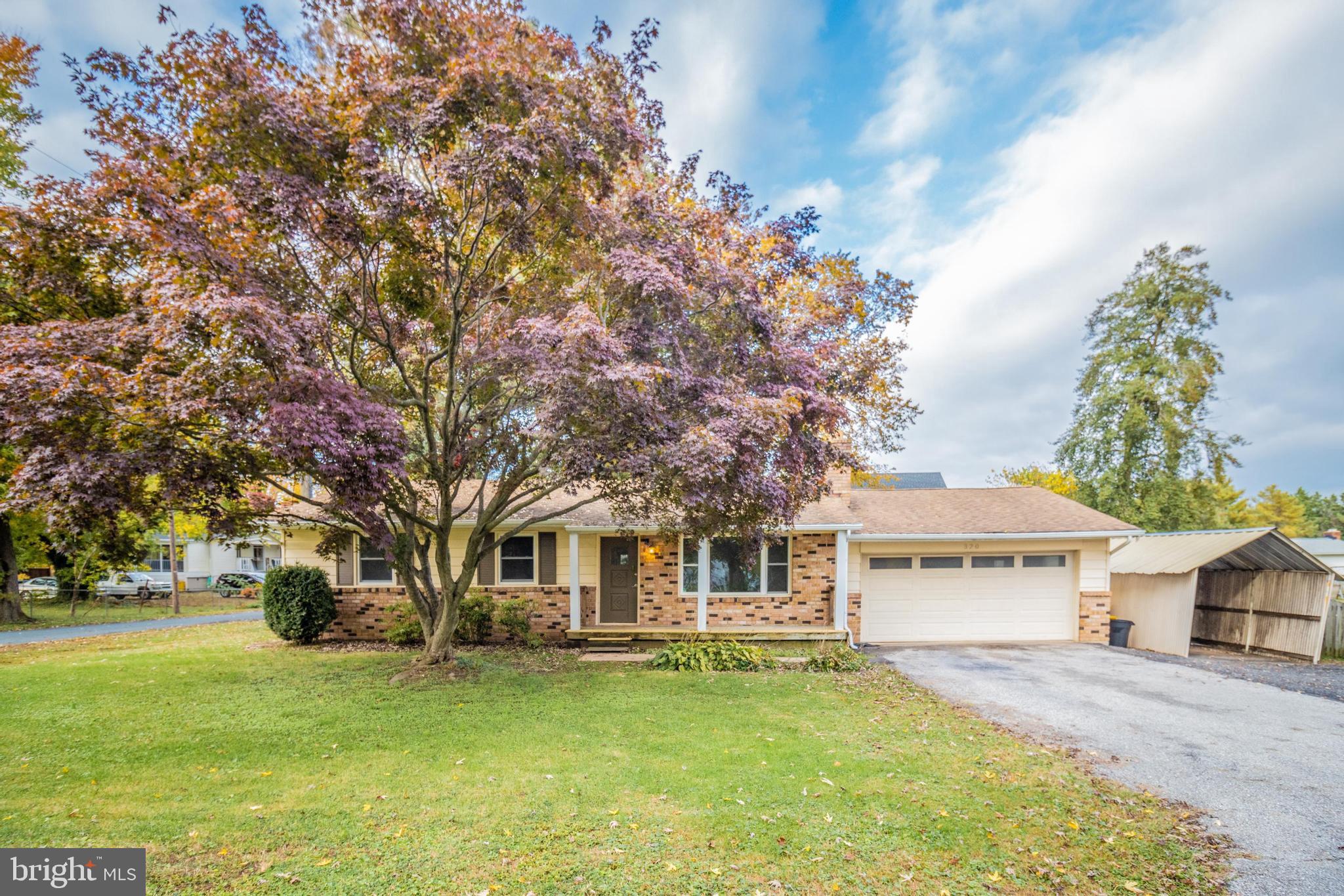 320 Kenmore Avenue Edgewater, MD 21037 - Photo 2 of 43 a front view of a house with a garden