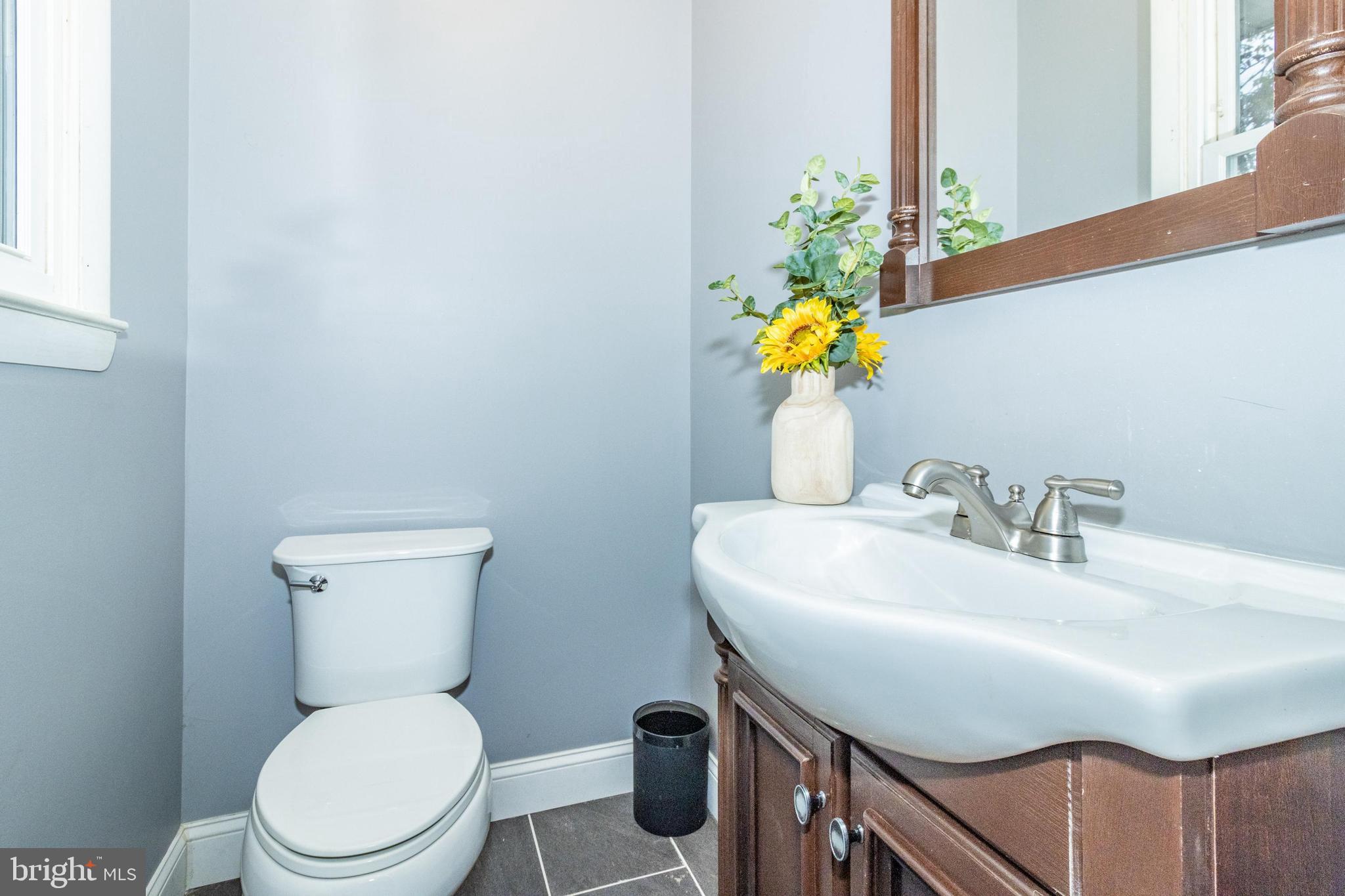 320 Kenmore Avenue Edgewater, MD 21037 - Photo 25 of 43 a bathroom with a sink toilet and mirror