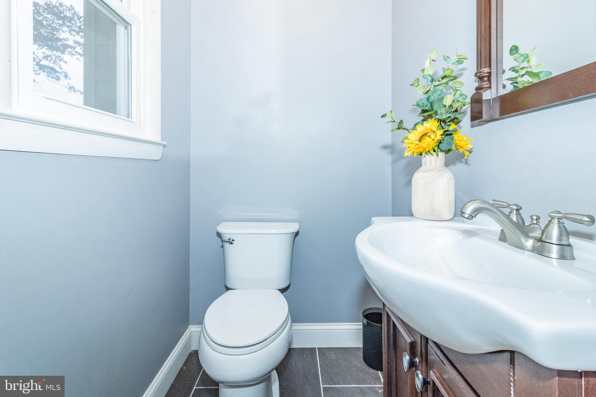 320 Kenmore Avenue Edgewater, MD 21037 - Photo 26 of 43 a bathroom with a sink and a toilet