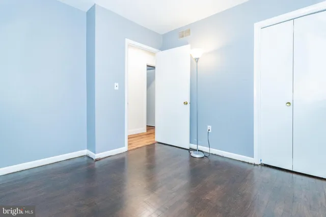 a bathroom with a granite countertop sink a toilet and bathtub