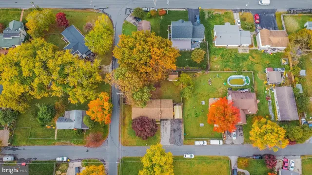 an aerial view of residential house with outdoor space and swimming pool