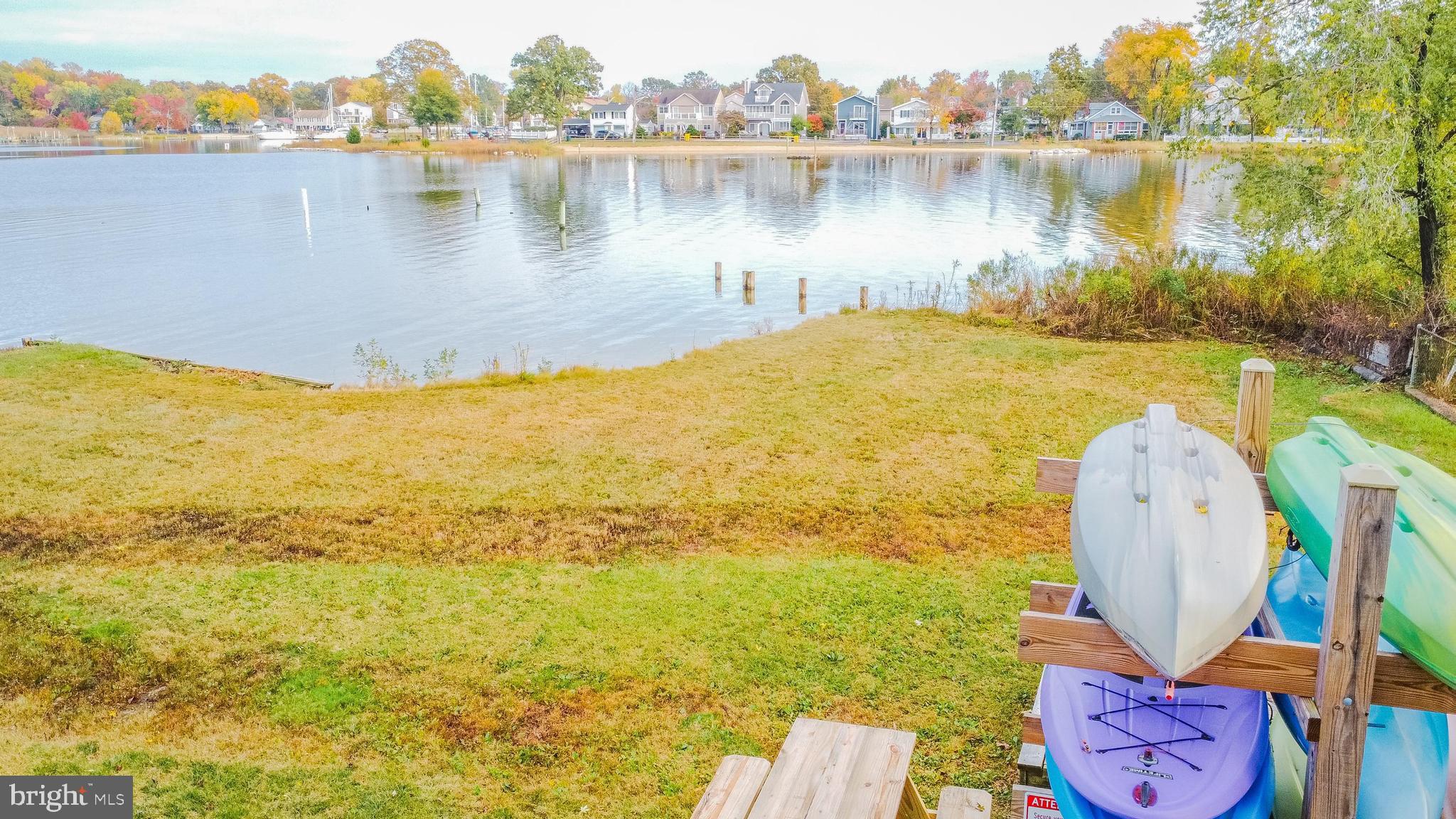 320 Kenmore Avenue Edgewater, MD 21037 - Photo 10 of 43 a view of a lake with lawn chairs