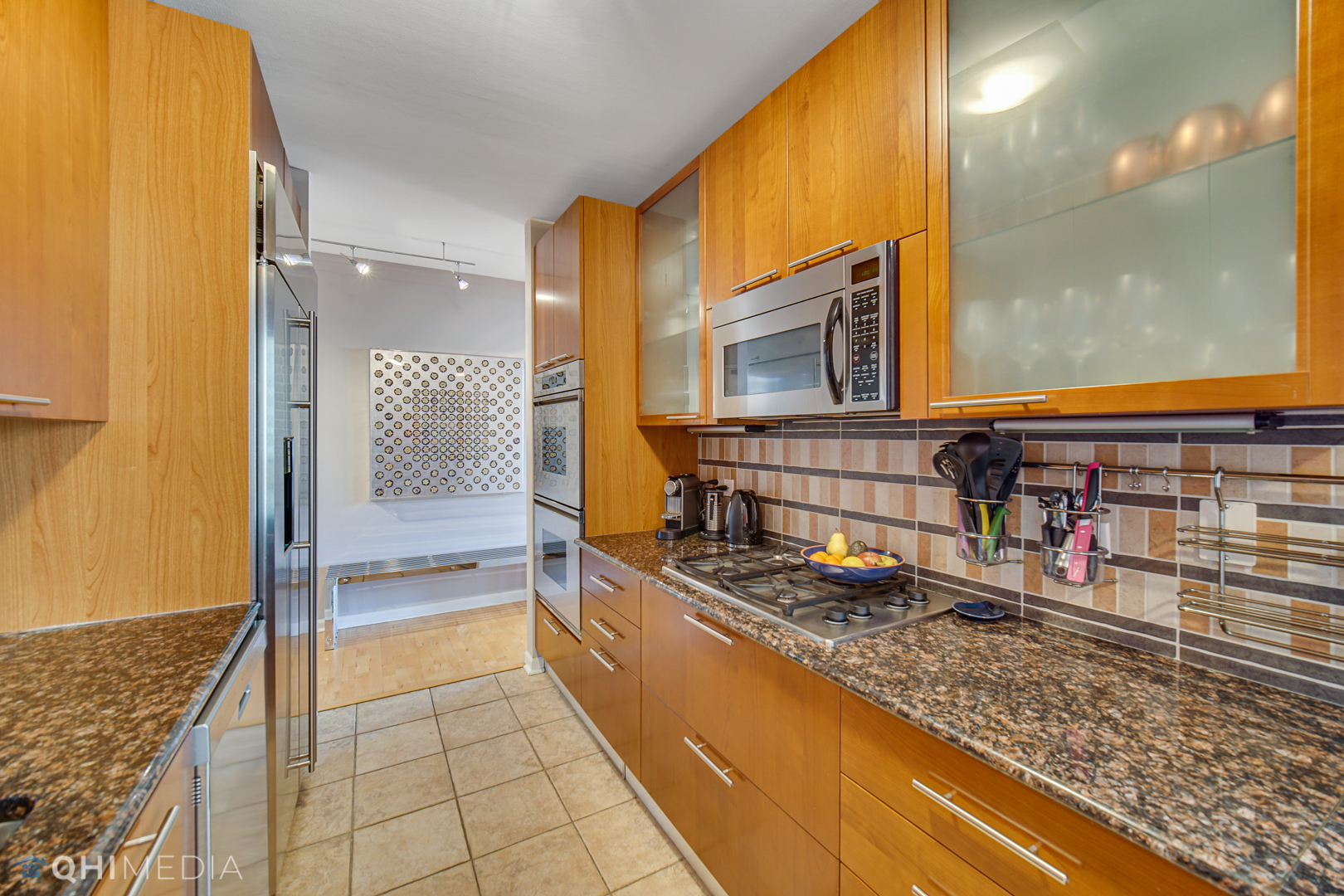 635 North Dearborn Street, Unit 1105 Chicago, IL 60654 - Photo 12 of 27 a kitchen with sink and cabinets
