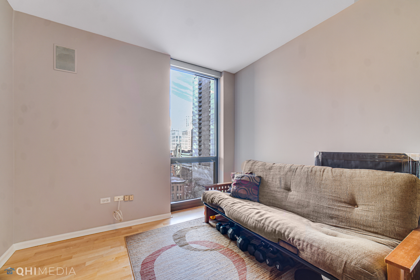 635 North Dearborn Street, Unit 1105 Chicago, IL 60654 - Photo 21 of 27 a living room with furniture and a couch