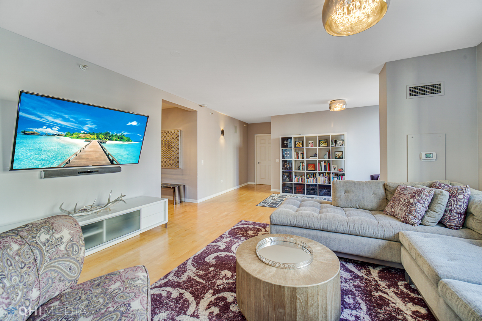 635 North Dearborn Street, Unit 1105 Chicago, IL 60654 - Photo 5 of 27 a living room with furniture and a flat screen tv