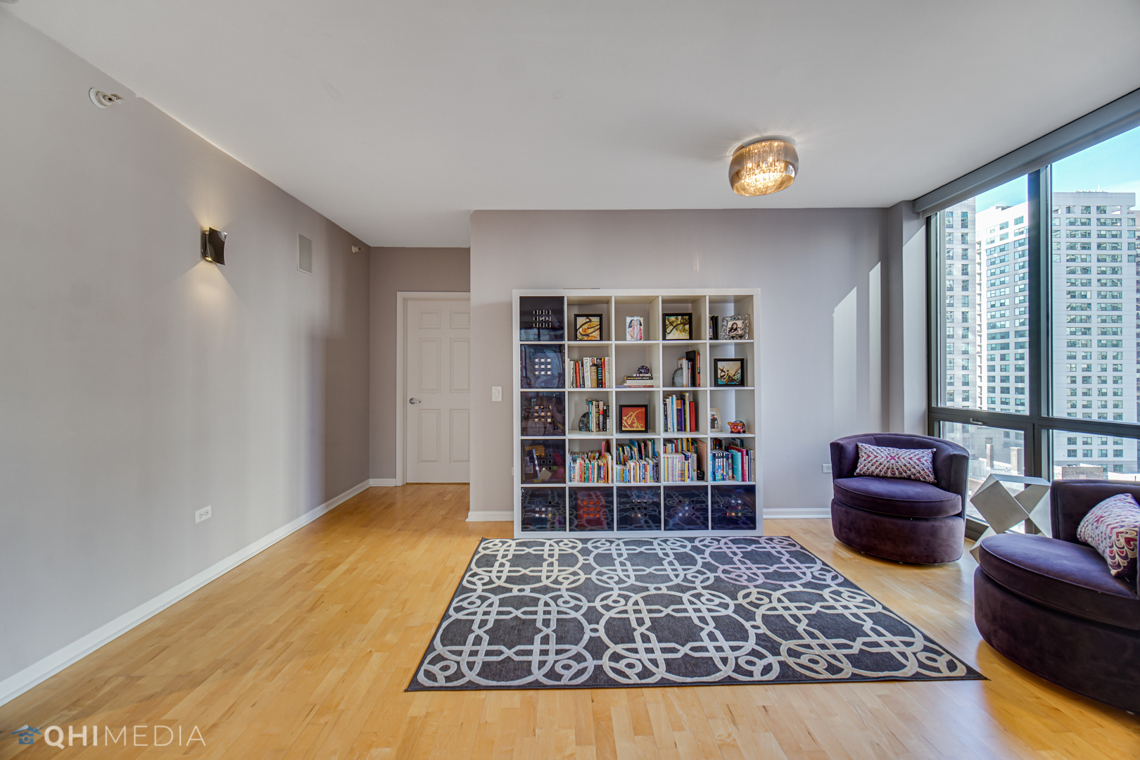 635 North Dearborn Street, Unit 1105 Chicago, IL 60654 - Photo 9 of 27 a living room with furniture and a rug