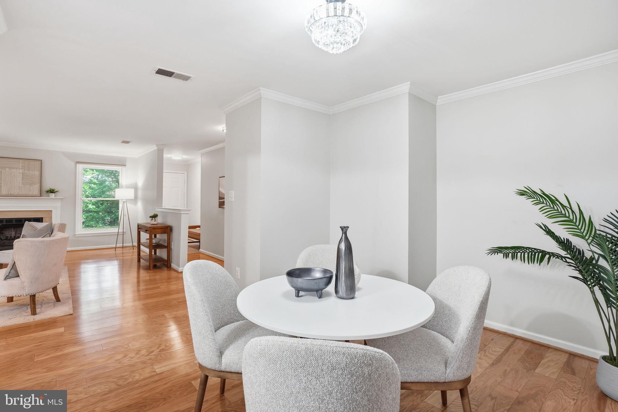 1495 Church Hill Place Reston, VA 20194 - Photo 9 of 27 a view of a dining room with furniture and wooden floor