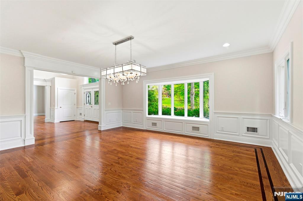 767 Orangeburgh Road River Vale, NJ 07675 - Photo 19 of 49 a view of an empty room with wooden floor and a window