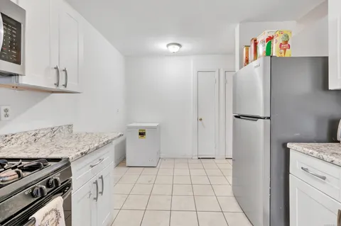 a kitchen with a stove and a refrigerator