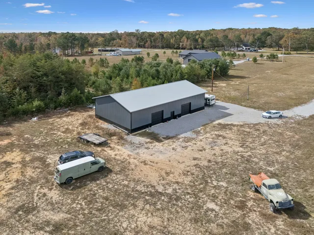 a view of a lake with a mountain and trees in the background