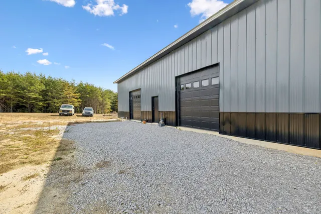 a view of backyard with garage