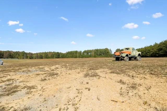 a view of lake with sunset