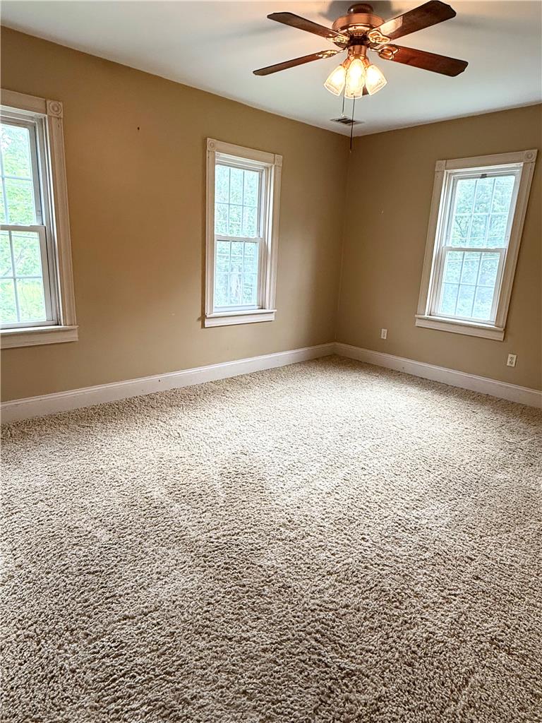 740 Engler Road Nazareth, PA 18064 - Photo 12 of 27 A well-lit bedroom features plush carpeting and multiple windows.