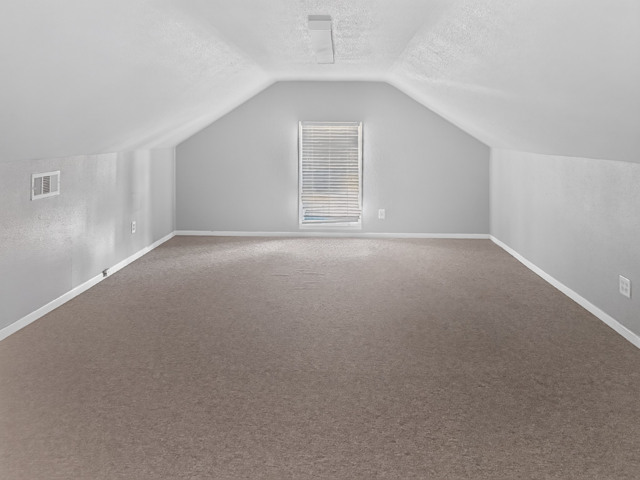 2313 Avenue L Rosenberg, TX 77471 - Photo 27 of 31 Alternate view of the versatile upstairs bonus room featuring ample floor space and natural light.