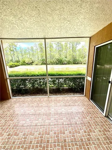 a view of a porch with wooden floor and stairs