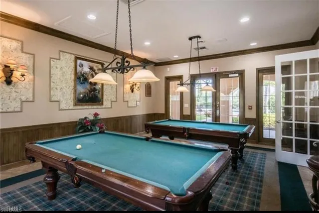 a room with pool table table tennis pool table and windows