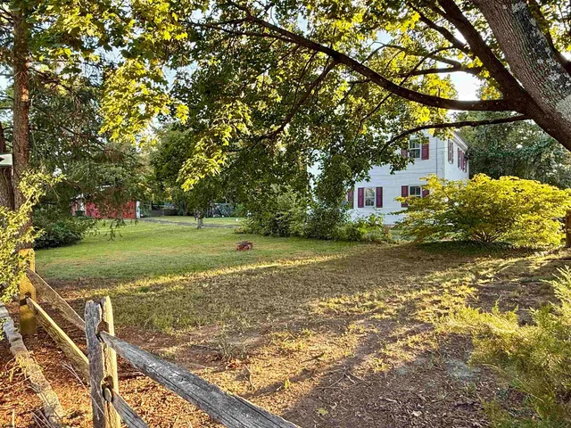 a view of a tree in front of a house