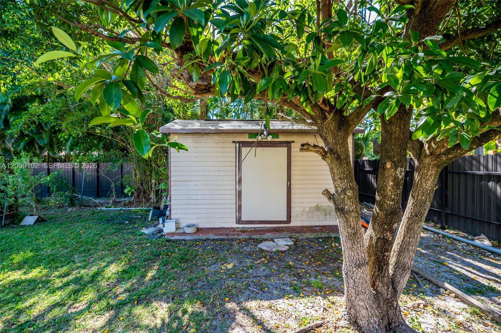 330 Southwest 27th Road Miami, FL 33129 - Photo 45 of 62 a backyard of a house with lots of green space