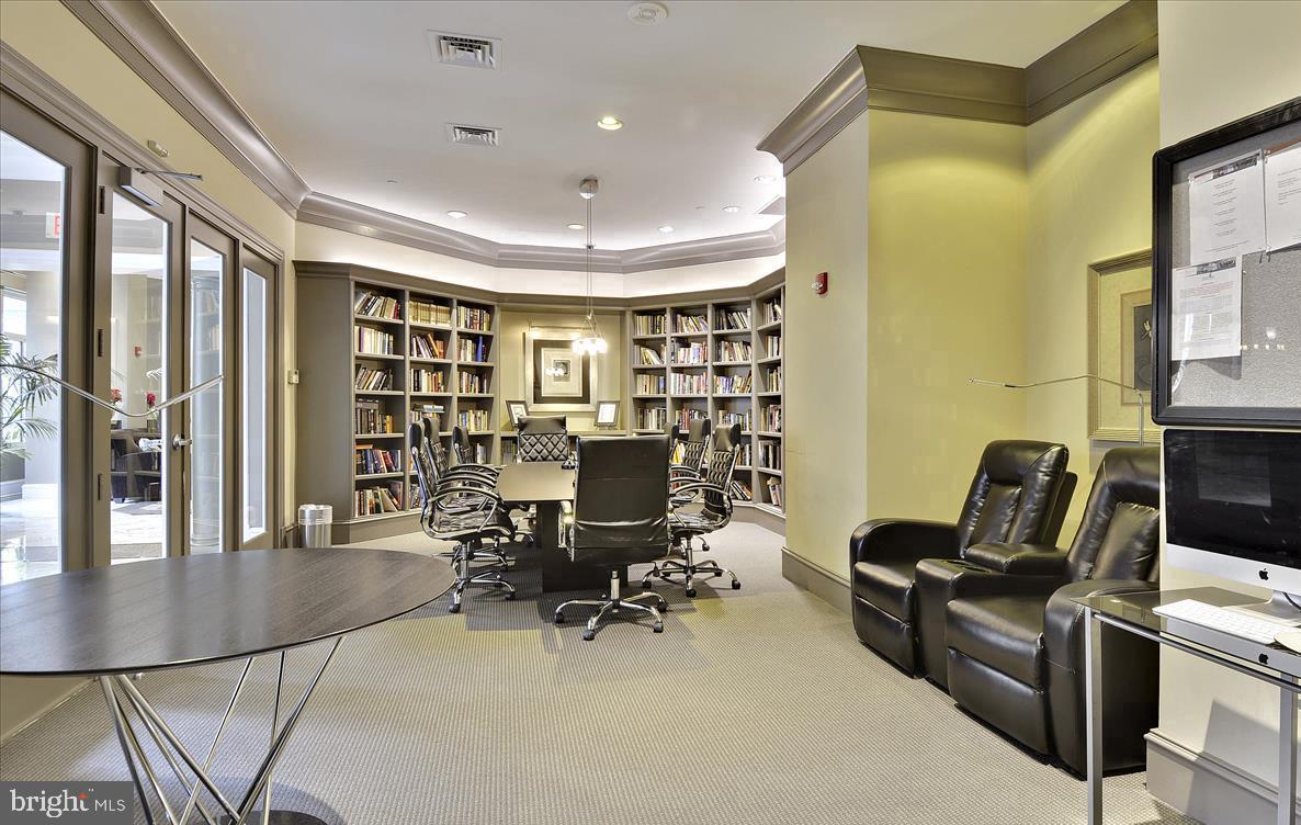 851 North Glebe Road, Unit 1113 Arlington, VA 22203 - Photo 5 of 30 a view of a livingroom with workspace and a window