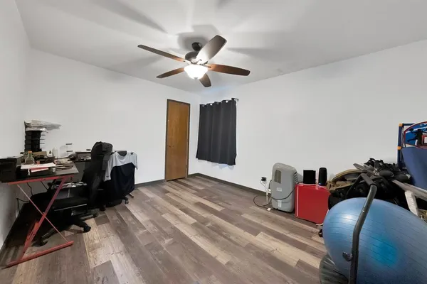 a bed room with a bed and a chandelier