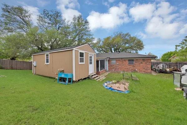 a view of a backyard with a garden