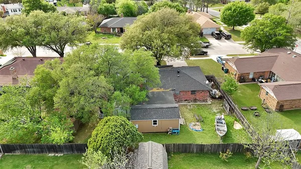 an aerial view of a house with a garden