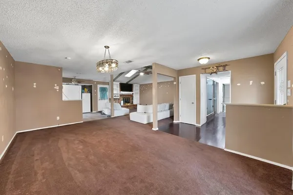a view of a livingroom with a furniture and fireplace