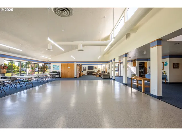 a view of a hall with dining room