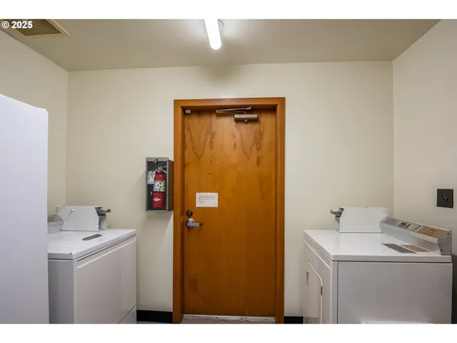 a kitchen with stainless steel appliances a stove a sink and cabinets