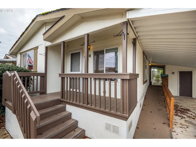 a view of a house with wooden deck