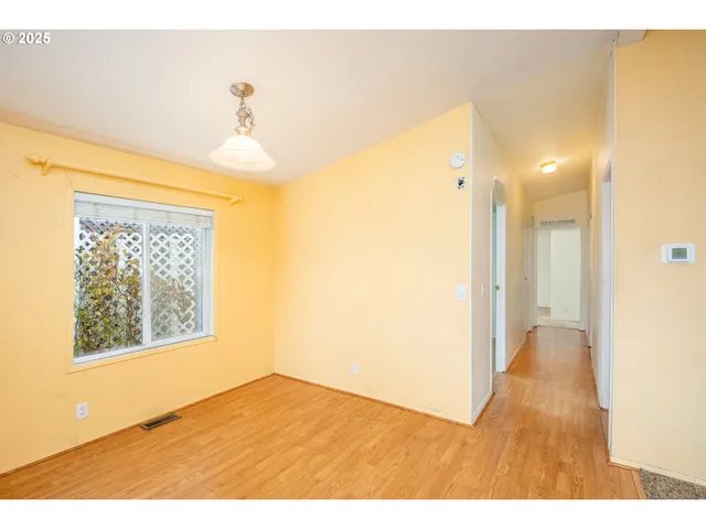 a view of an empty room and window