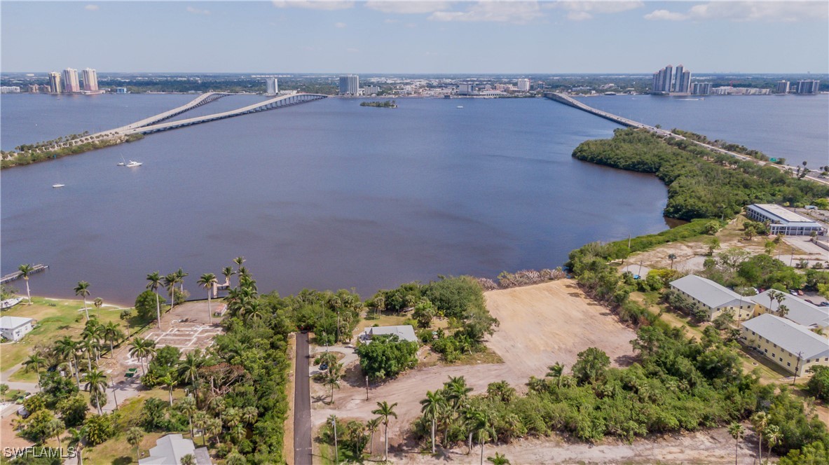 1059 River Road North Fort Myers, FL 33903 - Photo 15 of 15 an aerial view of a house with a yard and lake view