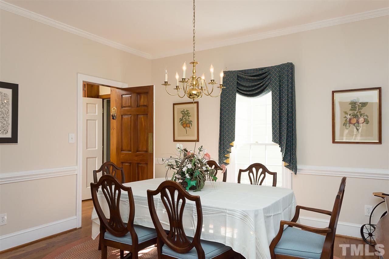 4820 Oak Way Raleigh, NC 27613 - Photo 14 of 25 a view of a dining room with furniture window and wooden floor