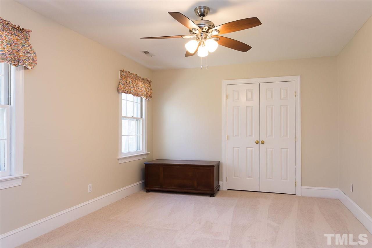 4820 Oak Way Raleigh, NC 27613 - Photo 19 of 25 an empty room with windows and fan