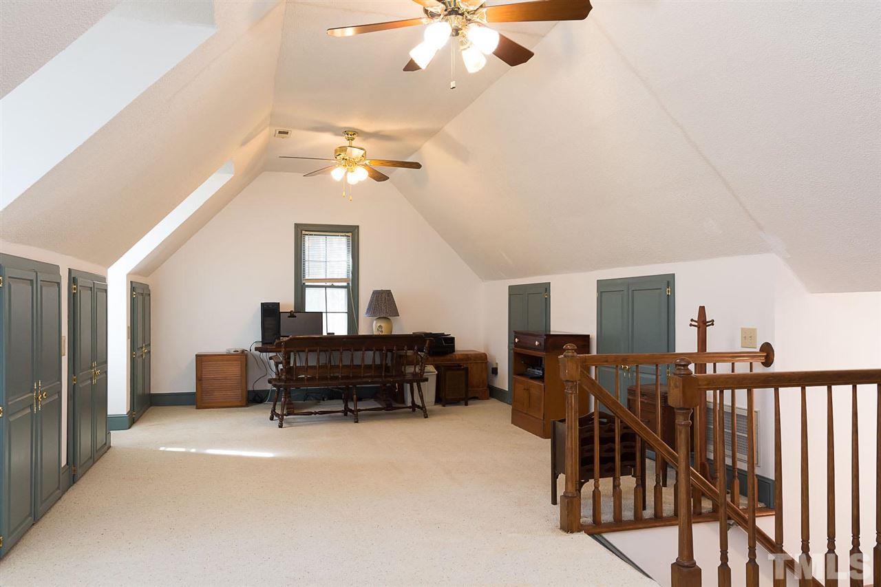 4820 Oak Way Raleigh, NC 27613 - Photo 20 of 25 a living room with furniture and a chandelier