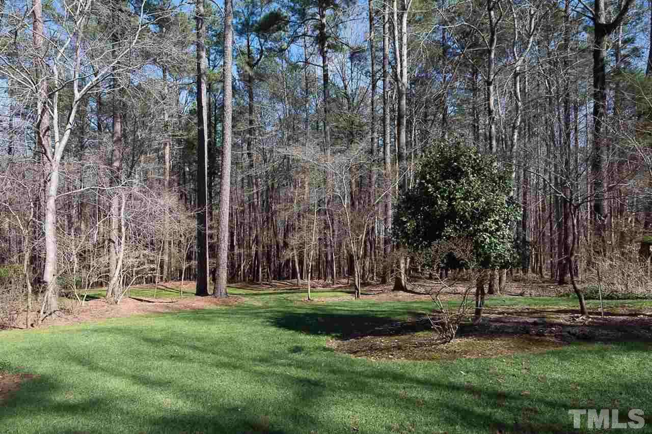 4820 Oak Way Raleigh, NC 27613 - Photo 23 of 25 front view of a building with a yard