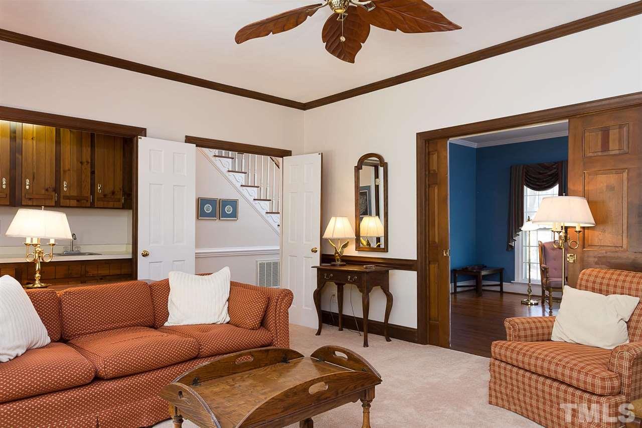 4820 Oak Way Raleigh, NC 27613 - Photo 8 of 25 a living room with furniture and a window