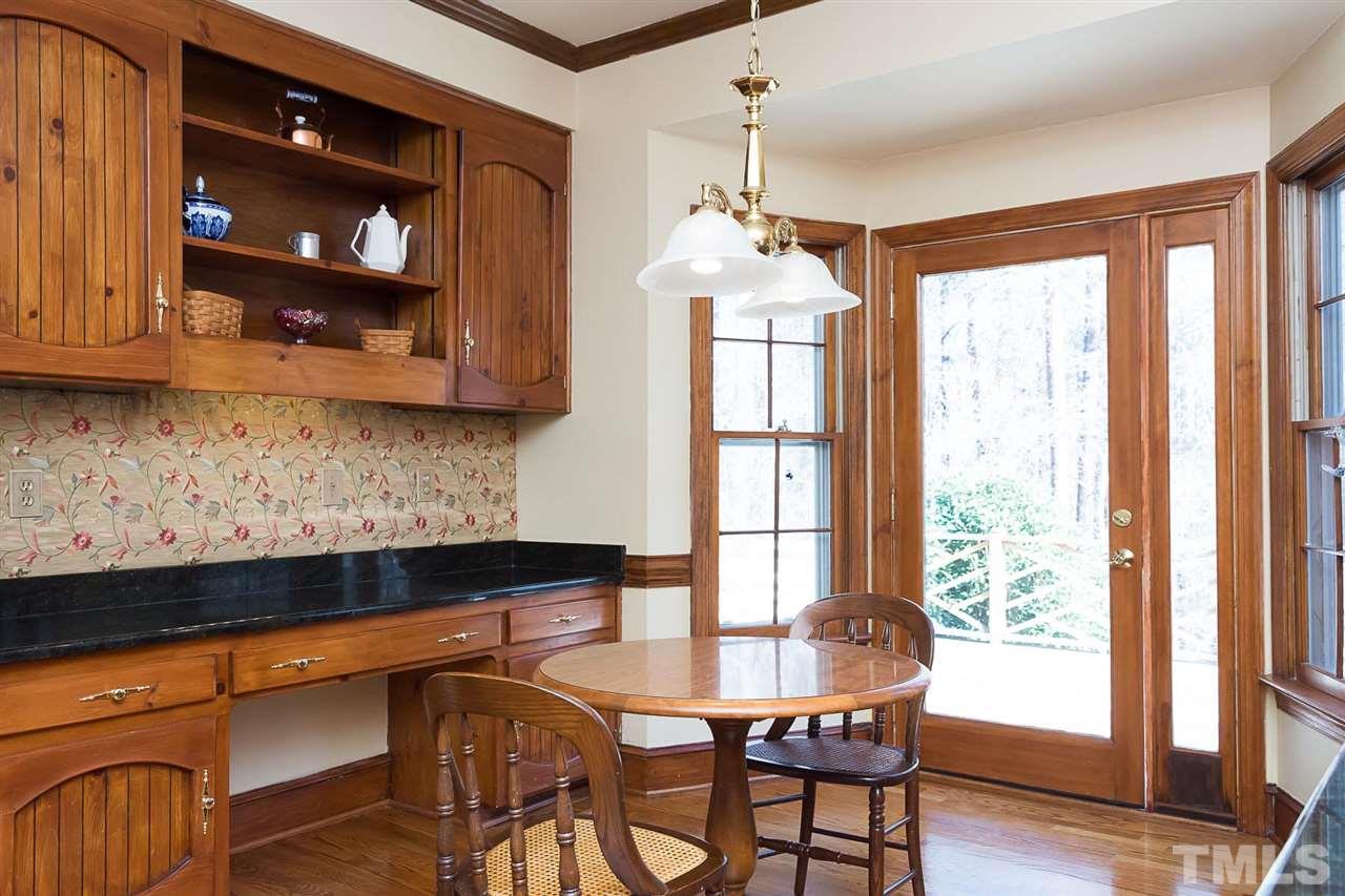 4820 Oak Way Raleigh, NC 27613 - Photo 10 of 25 a view of a dining room with furniture window and wooden floor