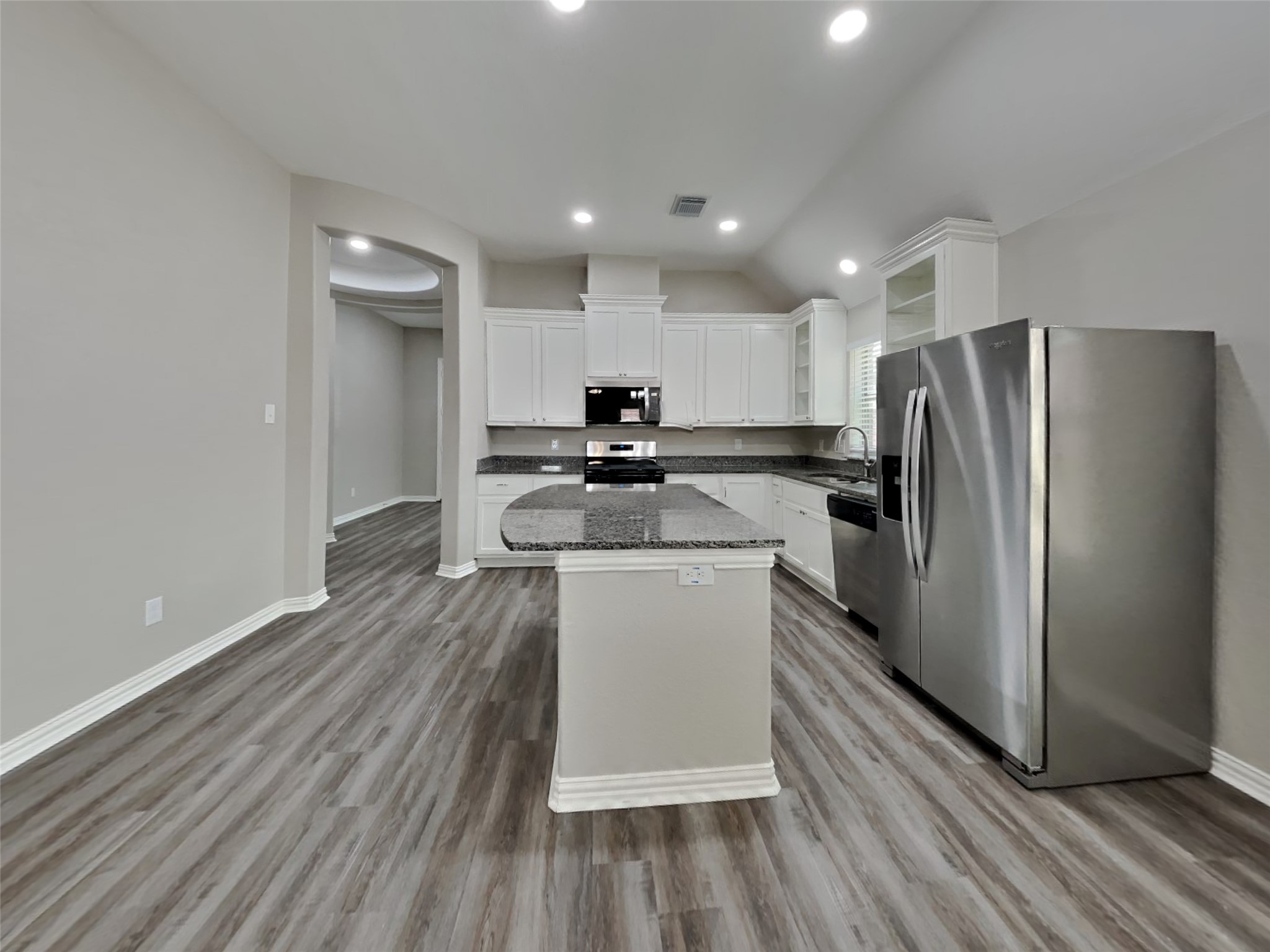 3007 Lockeridge Village Drive Spring, TX 77386 - Photo 5 of 18 a kitchen with stainless steel appliances granite countertop a refrigerator stove and oven