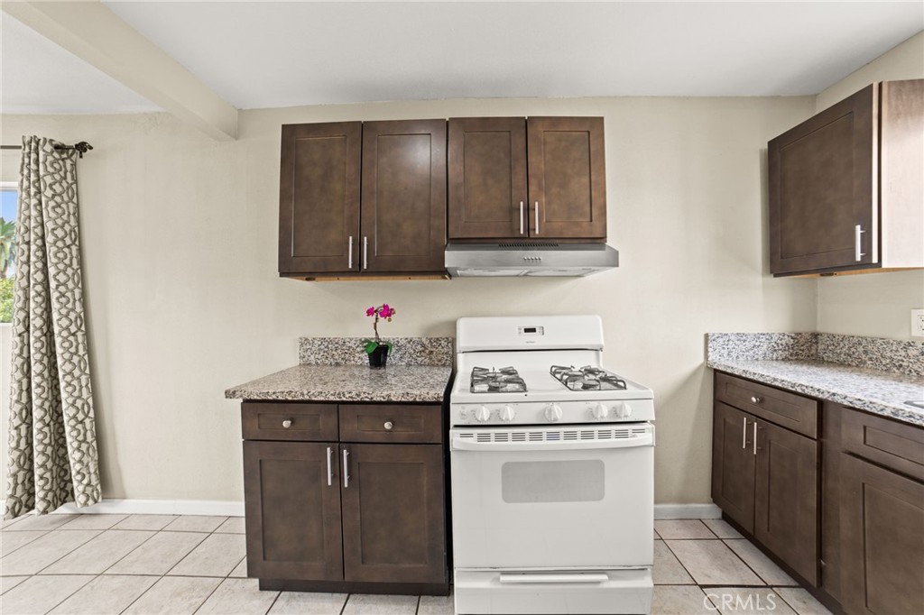 3717 Roosevelt Street Riverside, CA 92503 - Photo 19 of 27 a kitchen with a stove and a cabinets