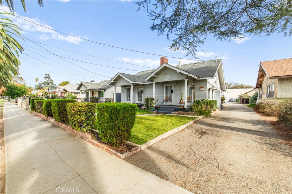 3717 Roosevelt Street Riverside, CA 92503 - Photo 2 of 27 a front view of a house with a yard