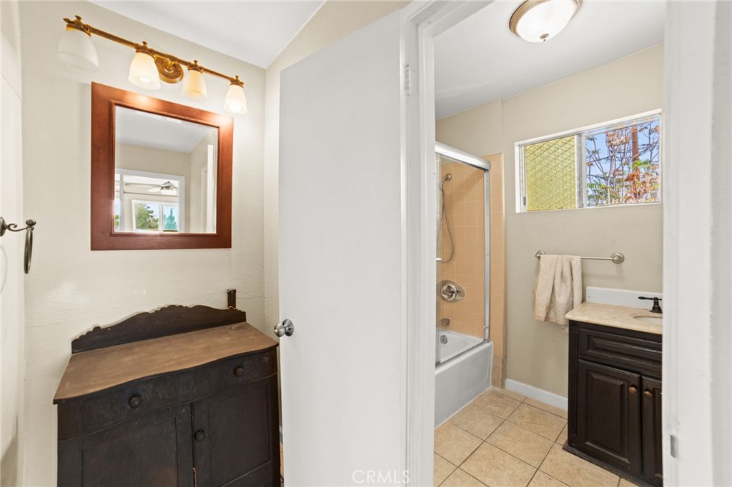 3717 Roosevelt Street Riverside, CA 92503 - Photo 26 of 27 a bathroom with a sink and a mirror