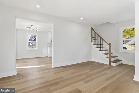 a view of an entryway with wooden floor