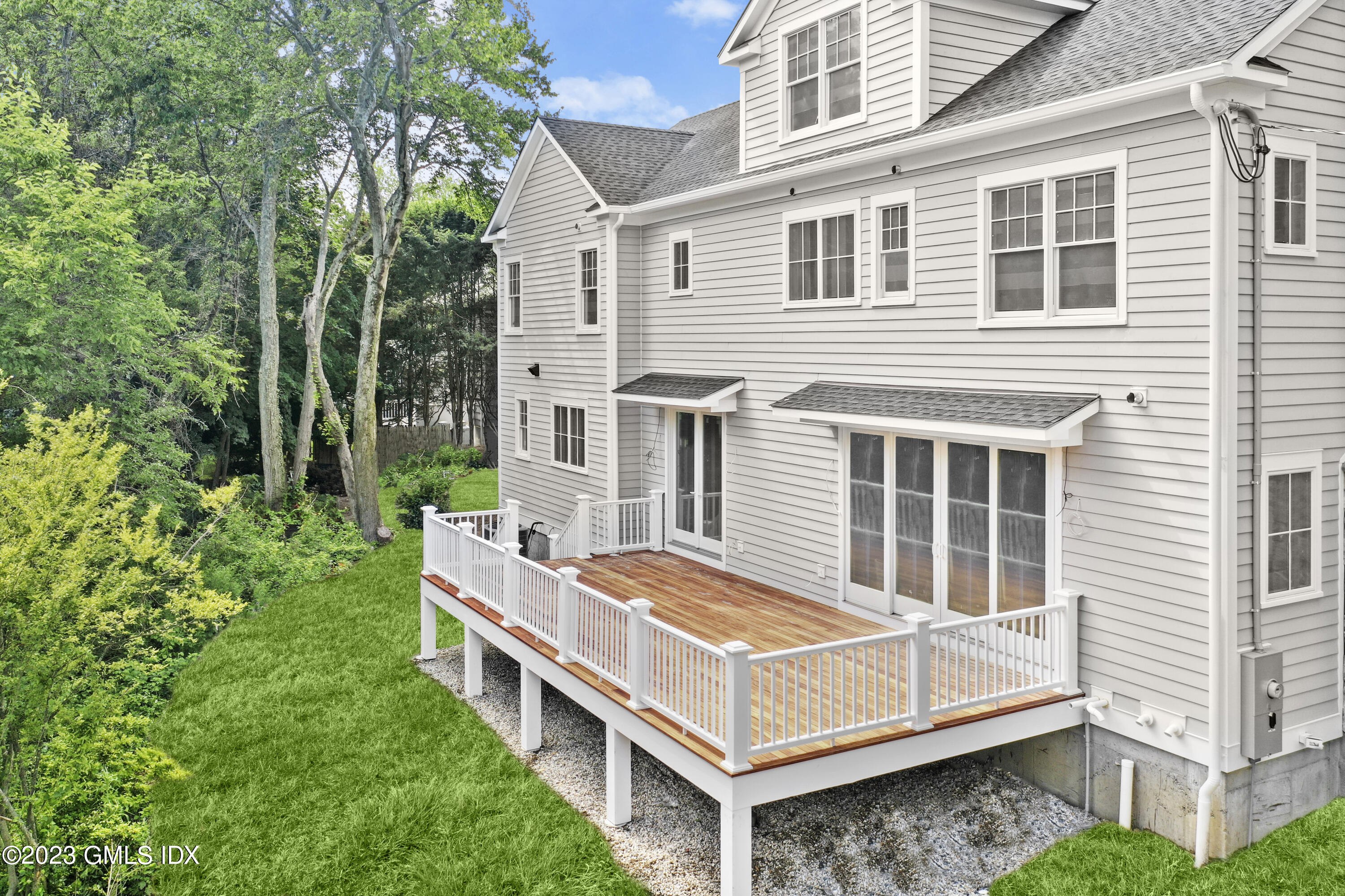 34 Laforge Road Darien, CT 06820 - Photo 2 of 8 a view of a house with a backyard and balcony