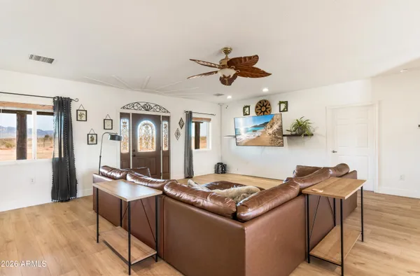 a living room with furniture and a window