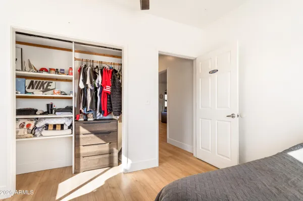 a view of a bedroom with a bed and closet