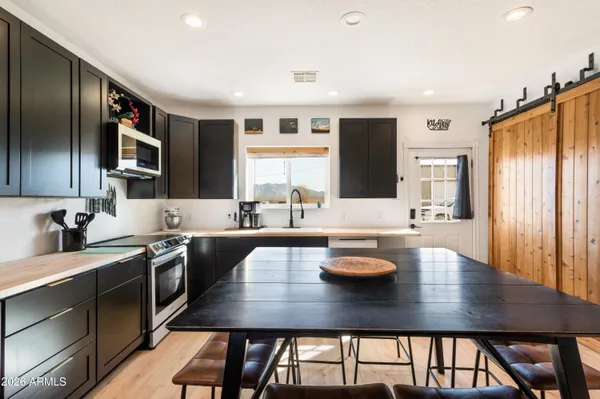a kitchen with a sink cabinets and stainless steel appliances