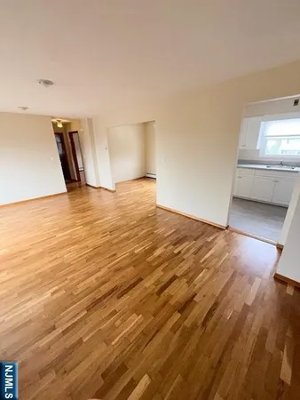 a view of room and wooden floor
